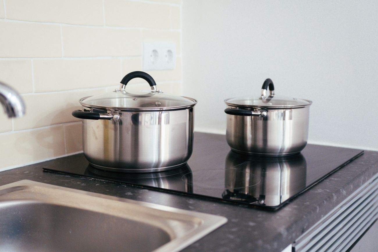 Stainless steel pots on an induction cooktop