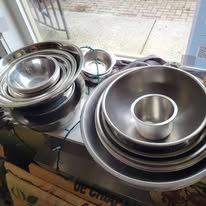Stacks of stainless steel mixing bowls