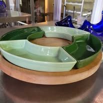 Green divided serving tray on a lazy Susan