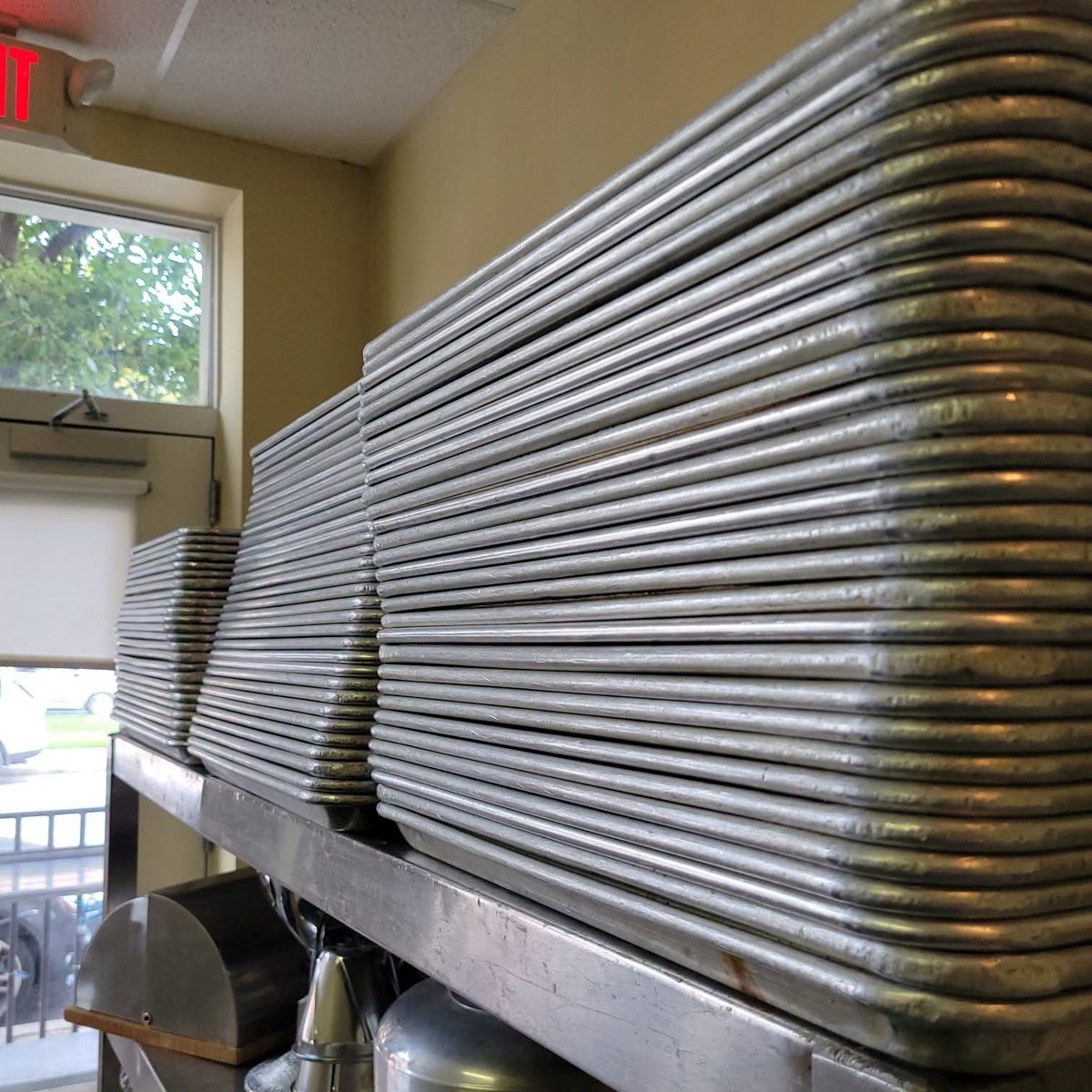 Stacks of aluminum sheet pans